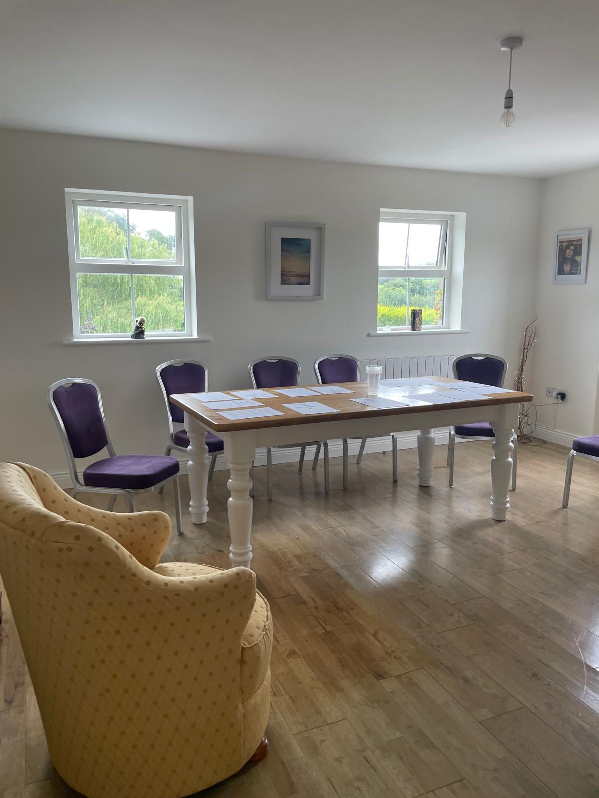 Table with working papers and sofa