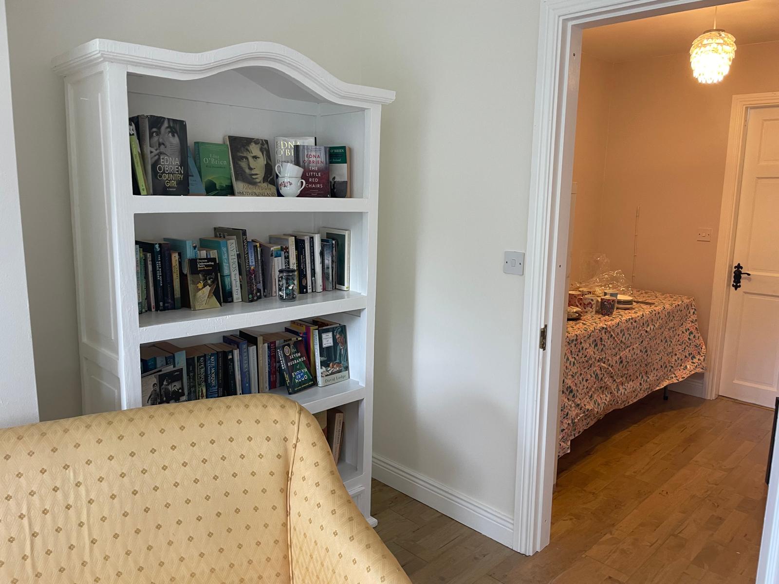 Bookcase with coffee area in background